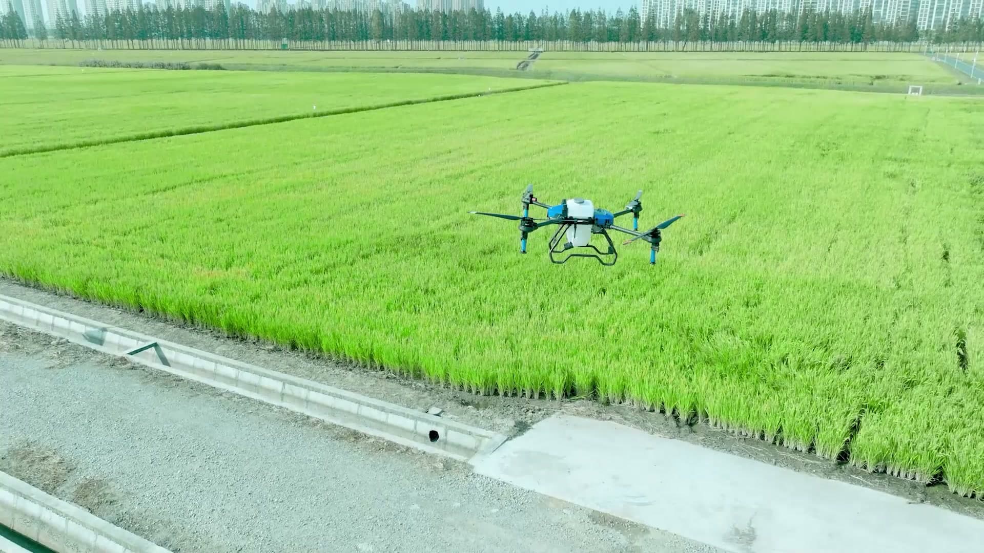 EAVISION J100 agricultural drone flying over a cultivated field