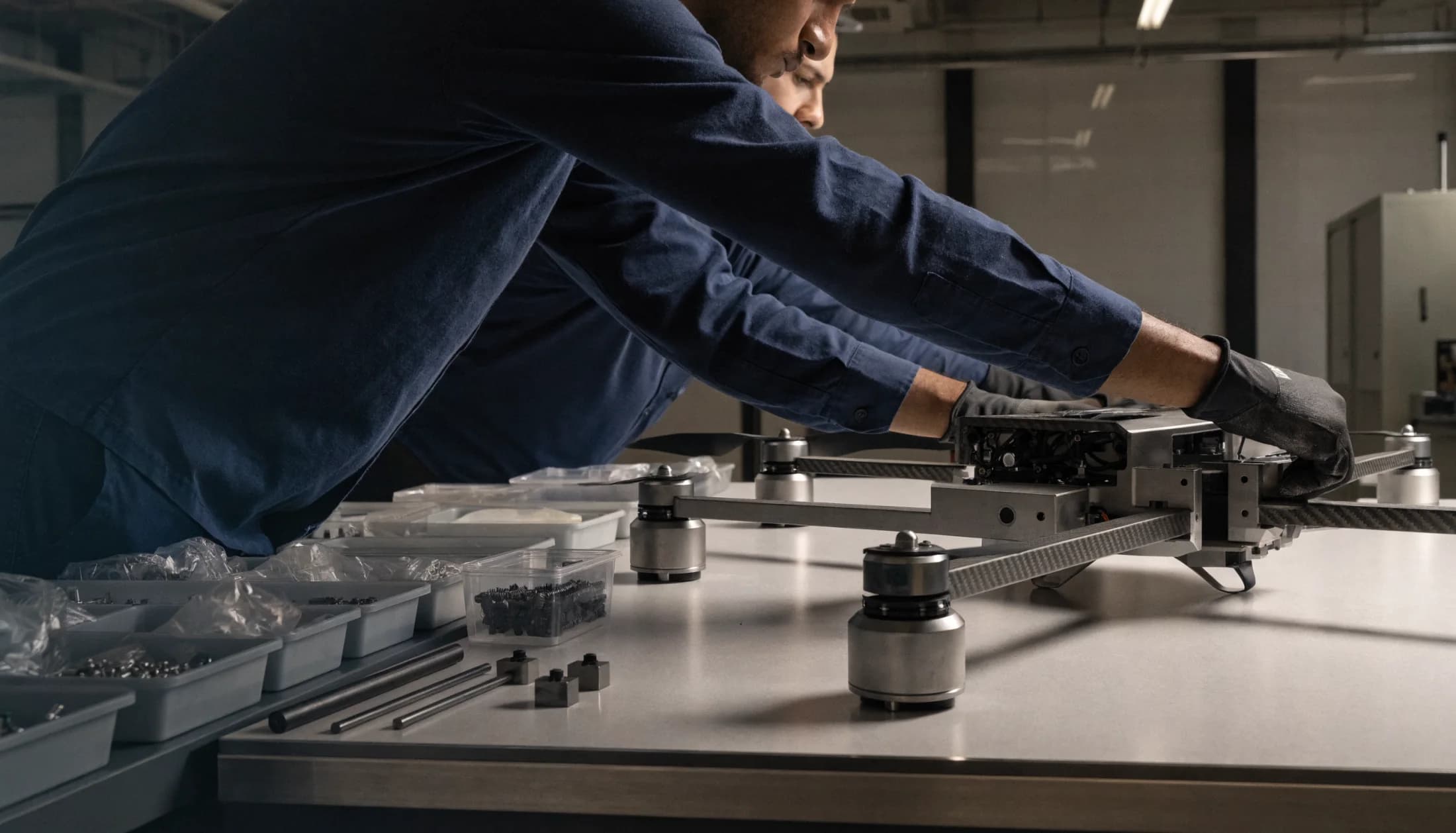 Technicians assembling a professional drone in an American aerospace workshop