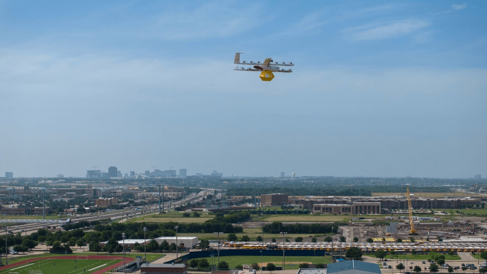 Wing delivery aircraft carrying a package over a U.S. metropolitan area
